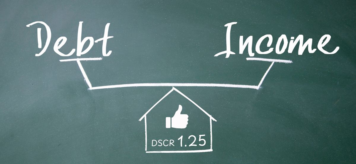 Chalkboard graphic illustrating DSCR by balancing income versus debt, highlighting a 1.25 coverage ratio.